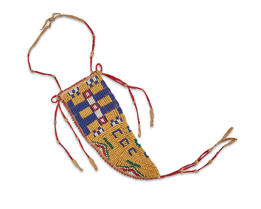 A Plains beaded hide knife sheath: A Plains beaded hide knife sheath Late 19th century A tapered sheath of buffalo hide construction worked on each side in yellow, green, red, blue, and white beads in various geometric motifs, with