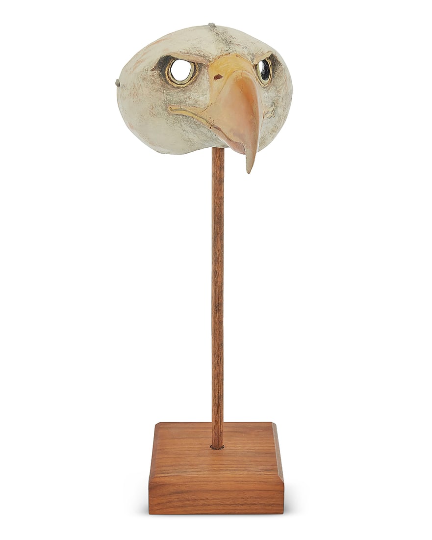 Hib Sabin (b. 1935), A bald eagle mask: Hib Sabin b. 1935 A bald eagle mask Carved and painted juniper Unsigned Height 4 3/4 in., width 6 3/8 in., depth 7 3/4 in.; stand height 17 in. including base Provenance: Per collector's notes,