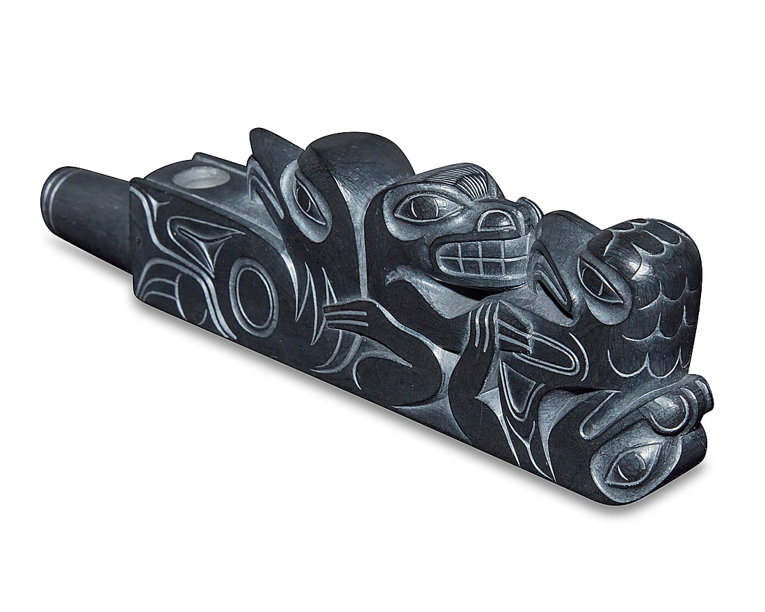 Earl Jones (b. 1949, Haida), A carved argillite pipe, late 20th/21st century: Earl Jones (b. 1949, Haida) A carved argillite pipe, late 20th/21st century; British Columbia The small pipe depicting two eagles and two bears Signed and titled to underside: Earl Jones / Haida, B.C.