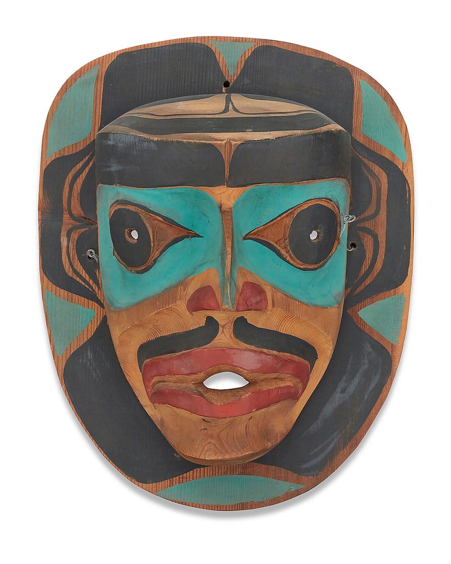 A Northwest Coast polychrome carved cedar mask: A Northwest Coast polychrome carved cedar mask Third quarter 20th century Marked in ink verso: NW / 64 Height 13 3/4 in., width 10 3/4 in., depth 5 1/2 in.