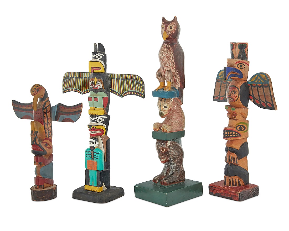 Four Northwest Coast-style polychrome painted totem models: Four Northwest Coast-style polychrome painted totem models First half 20th century The carved painted wood models of varying sizes, featuring stacked figures including eagles, an owl, bears, and a bea