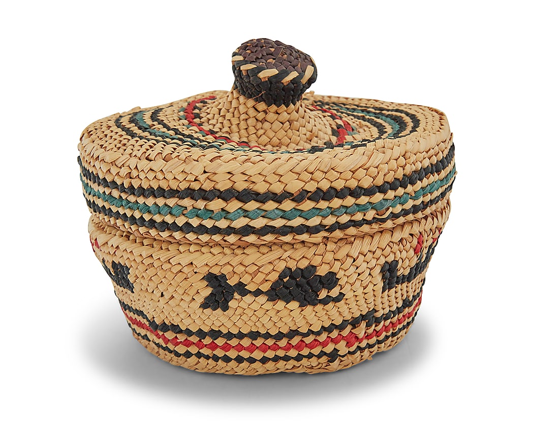 A Nuu-chah-nulth (Nootka) or Makah polychrome lidded basket: A Nuu-chah-nulth (Nootka) or Makah polychrome lidded basket Mid/late 20th century, Pacific Northwest Coast The small twined basket with polychrome banding to sides featuring figures in boats