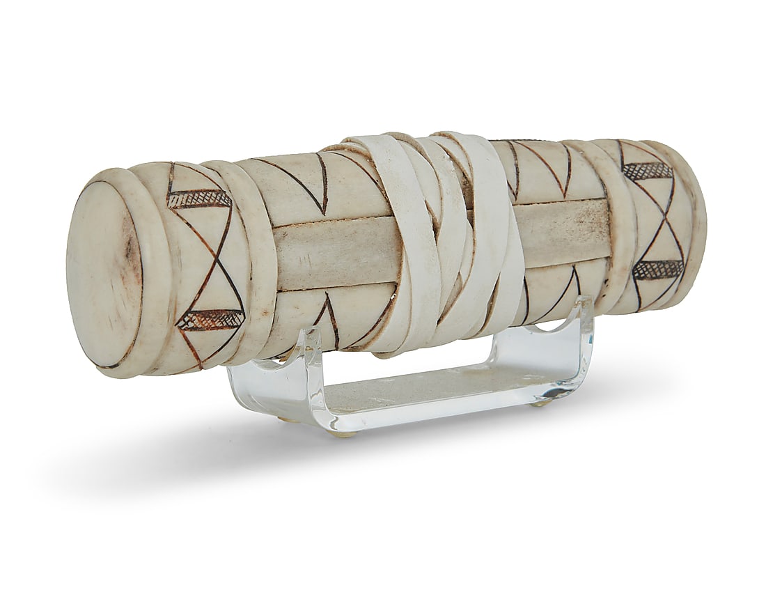 George Blake (b. 1944, Hupa/Yurok), A carved elk antler purse, circa 1988: George Blake (b. 1944, Hupa/Yurok) A carved elk antler purse with hide wrapping and incised triangular motifs, circa 1988 Appears unmarked Height 1 3/4 in., width 6 1/4 in., depth 1 1/2 in.