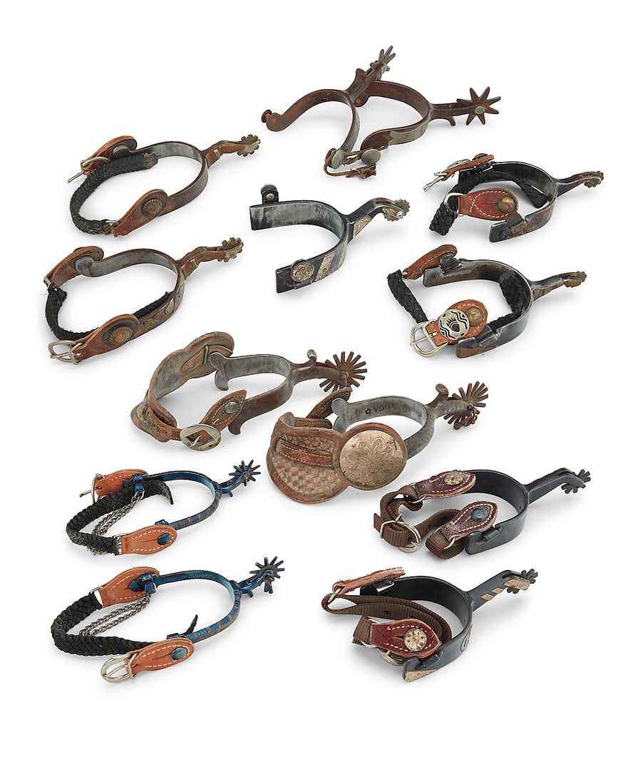 A group of Western spurs: A group of Western spurs 20th century Six pairs of spurs and one single spur, each of various style of heel, shank, and rowel, by various makers including Vogt, E. Garcia, Winchester, and Andrews