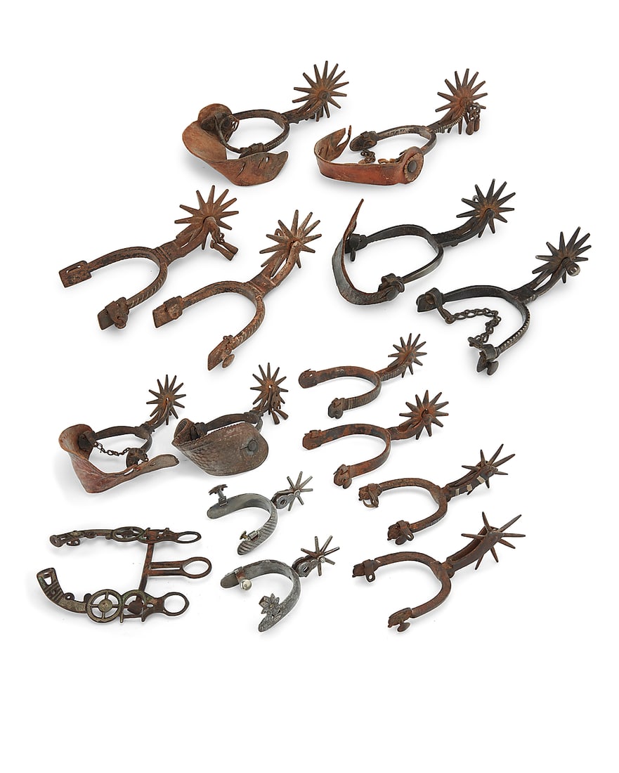 A large group of Mexican spurs and a headstall: A large group of Mexican spurs and a headstall Late 19th/20th century Seven pairs of Mexican spurs, each of various style of heel, shank, and rowel, most of wrought iron and with silver or mixed