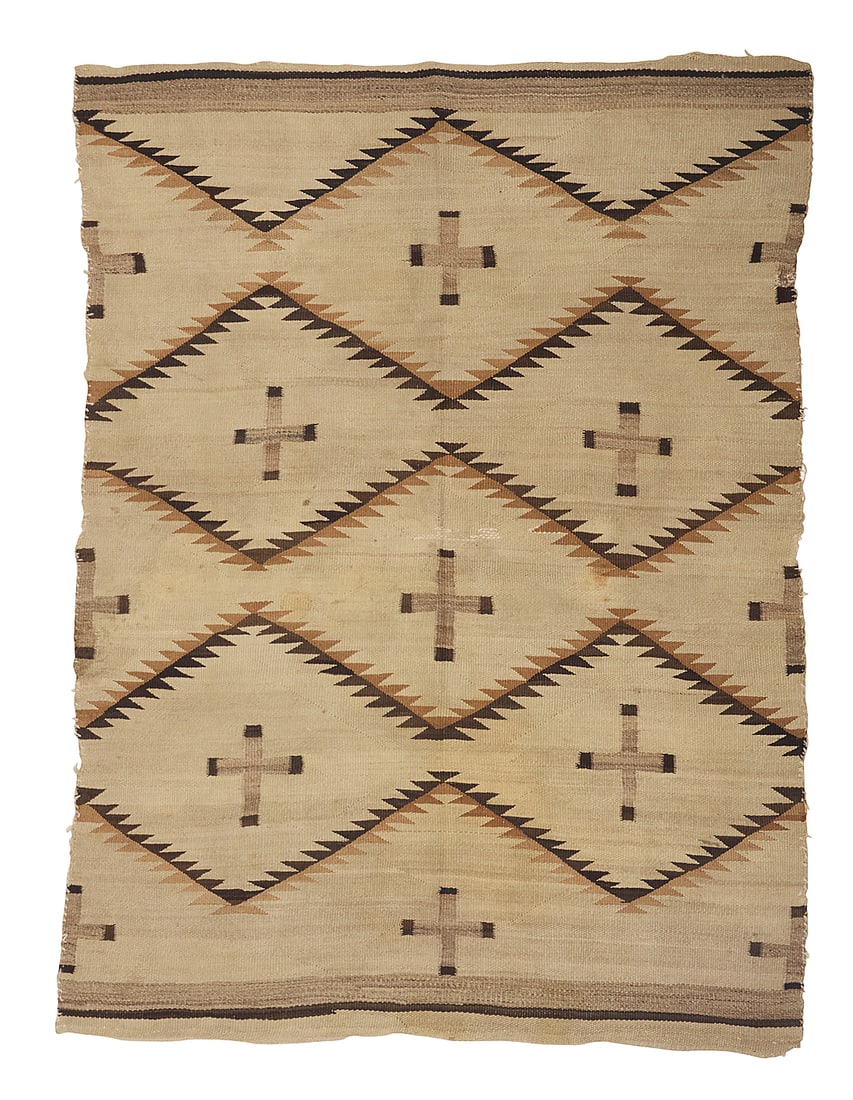 A Dine (Navajo) transitional weaving: A Dine (Navajo) transitional weaving Late 19th/early 20th century Woven in natural cream, mottled grey, brown and tan wool, featuring sawtooth zigzag bands with multiple floating crosses and striped