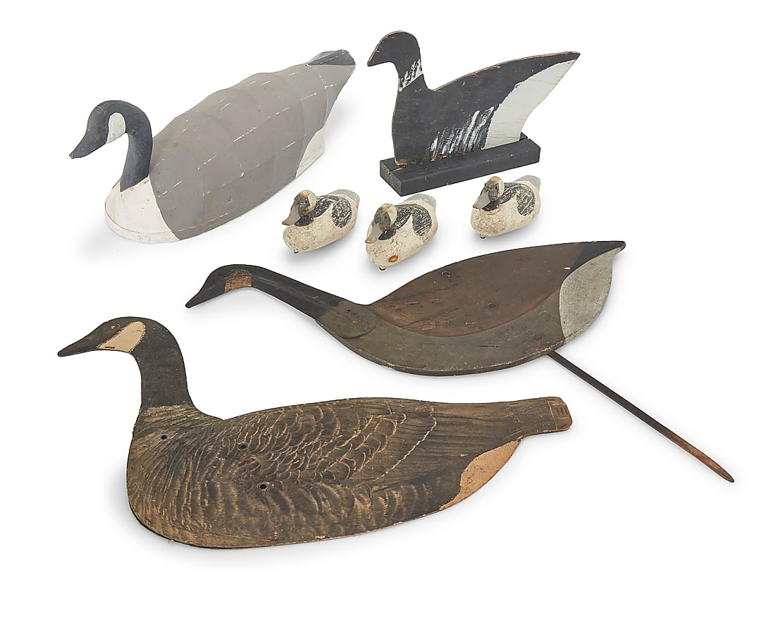 Seven Folk Art geese patio ornaments: Seven Folk Art geese patio ornaments Mid/late 20th century Canvas duck impressed to underside: SPORT EN ART; and signed: by Ron Vich Comprising three painted carved wood cygnet decoys, one painted woo