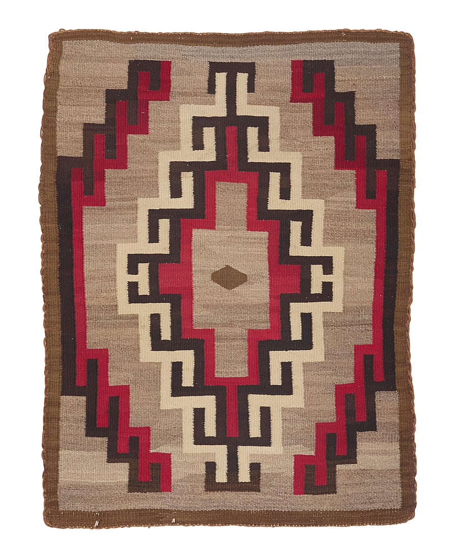 A Dine (Navajo) regional rug: A Dine (Navajo) regional rug Mid-20th century Woven in mottled brown, dark brown, tan, cream, and red wool featuring a central hooked diamond and narrow band border 4 x 3 ft. approximately
