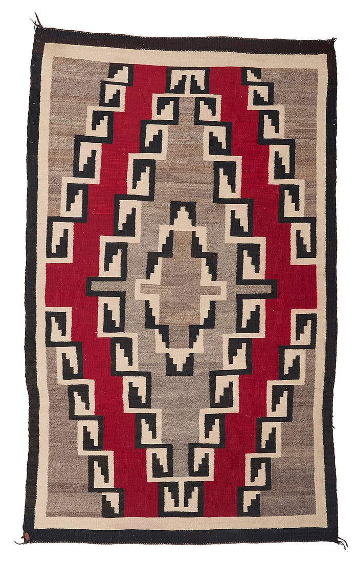 A Dine (Navajo) Ganado rug: A Dine (Navajo) Ganado rug Mid-20th century Woven in cream, red, black and mottled brown wool with multiple central elaborate stepped concentric diamonds with stepped hook details and banded borders 5