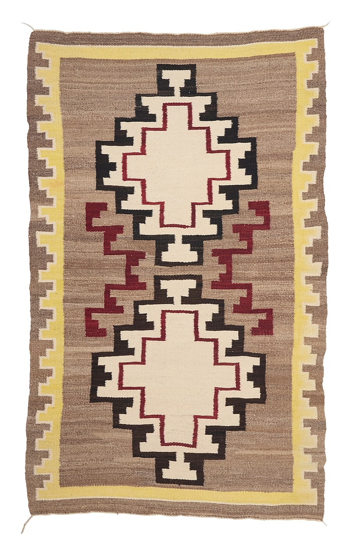 A Dine (Navajo) regional rug: A Dine (Navajo) regional rug Mid-20th century Woven in white, brown, yellow, red, and mottled brown wool featuring two stacked stepped diamonds with floating stepped motifs and with a stepped border t