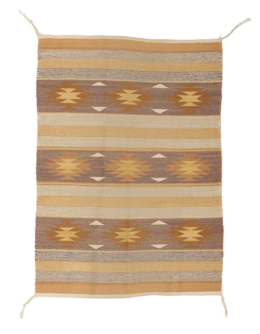 A Dine (Navajo) Chinle/Wide Ruins rug: A Dine (Navajo) Chinle/Wide Ruins rug Third quarter 20th century Woven in pale brown, ochre, yellow, cream, and grey wool in alternating serrated diamond and stripe banded motifs 4 ft. 1 in. x 2 ft.