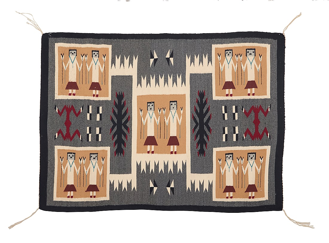 A Dine (Navajo) storm pattern pictorial Yei rug: A Dine (Navajo) storm pattern pictorial Yei rug Second half 20th century Woven in grey, black, red, cream, and blue in a storm pattern variation featuring five panels each with two standing Yei figure