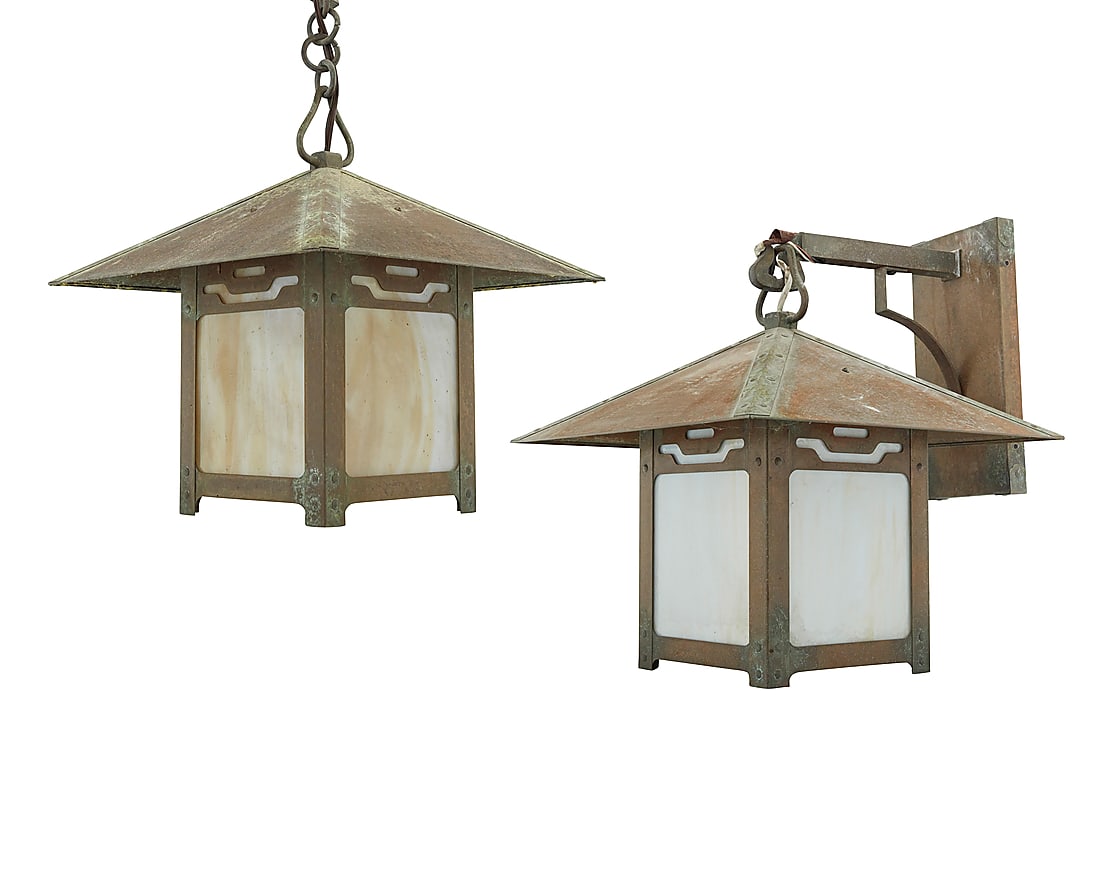 Two Old California Lantern Co. Arts & Crafts style lanterns: Two Old California Lantern Co. Arts & Crafts style lanterns 2003 and 2008 The patinated brass cases with slag glass panels housing a single light, one hanging from arm issued from wall-mounted escutch