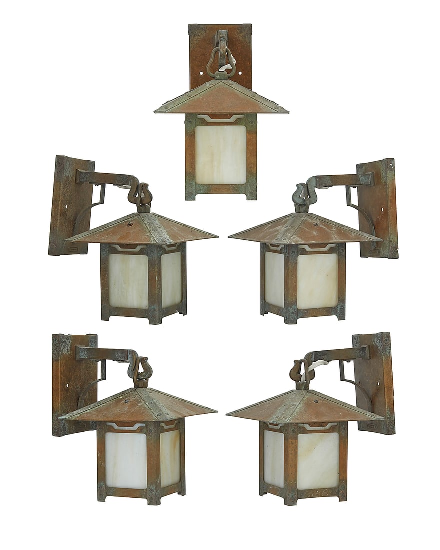 A set of five Old California Lantern Co. Arts & Crafts-style lanterns: A set of five Old California Lantern Co. Arts & Crafts-style lanterns 2004 The patinated brass cases with slag glass panels housing a single light, each hanging from arm issued from wall-mounted escut