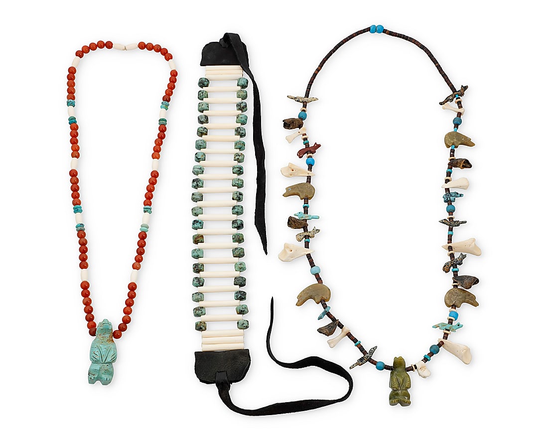 Three Southwest necklaces: Three Southwest necklaces Second half 20th century Comprising a heishi necklace with carved turquoise and stone fetish animals including heartline bears, wolves and birds, with trade beads and animal