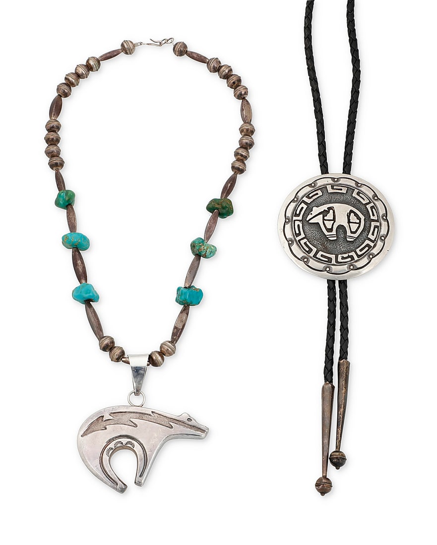 Two Southwest sterling silver bear-motif jewelry items: Two Southwest sterling silver bear-motif jewelry items Two works: Emerson Kinzel (20th century, Dine [Navajo]) A round sterling silver overlay concho-style bolo with a heartline bear motif and hooked