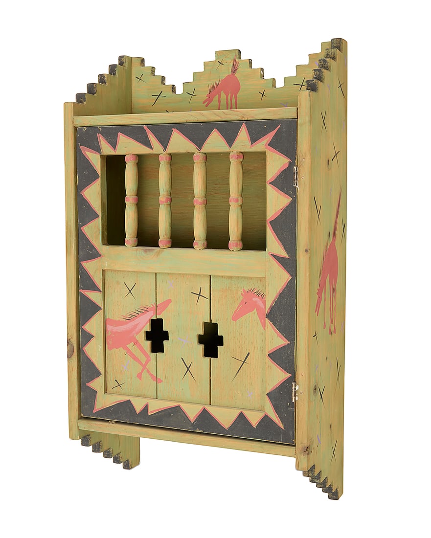 A Santa Fe-style painted wood wall cabinet: A Santa Fe-style painted wood wall cabinet 1989 Decorated with horses, with stepped gallery above a cabinet door with spindles to front, opening to reveal a single shelf, with wall-mounting hardware v