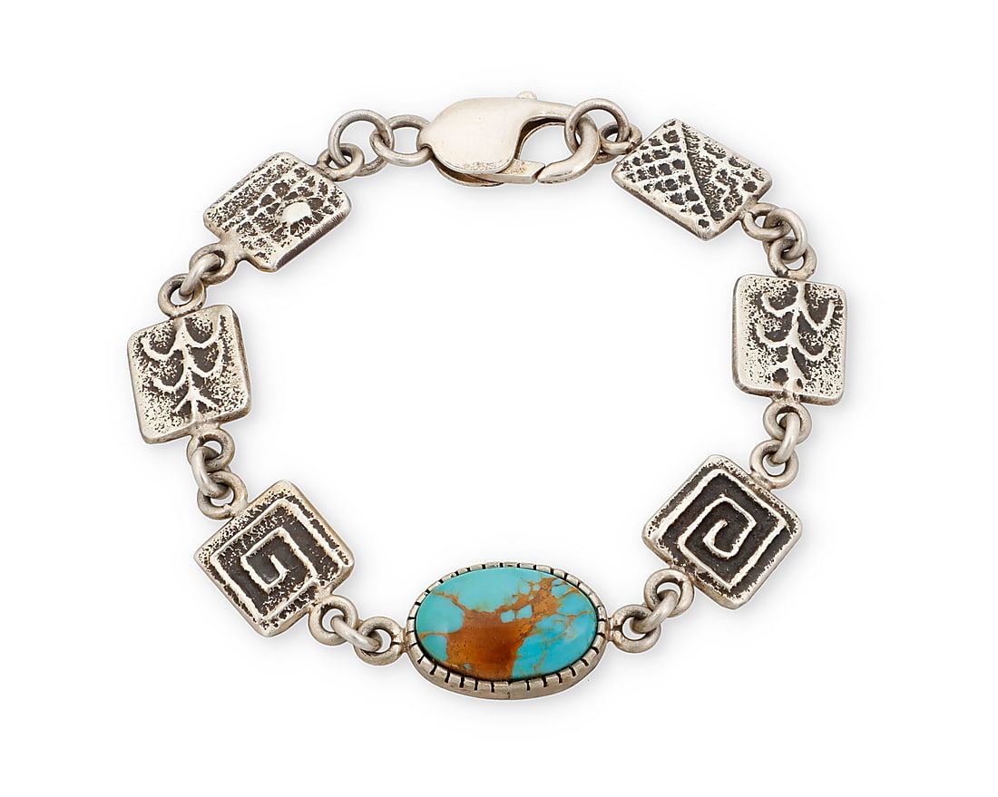 Harold Lovato (1954-1997, Kewa [Santo Domingo]), A silver and turquoise link bracelet: Harold Lovato (1954-1997, Kewa [Santo Domingo]) A delicate sterling silver link bracelet with a set turquoise link and sandcast links featuring corn stalks, maze swirls, and Pueblo motifs Stamped; HL