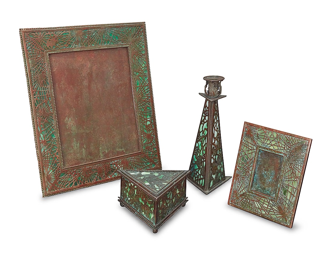 Four Riviere Studios bronze and glass desk items: Four Riviere Studios bronze and glass desk items Early 20th century Verdigris patinated, comprising two easel-back pine frames with pine needle design and a triangular box with holly design, together 
