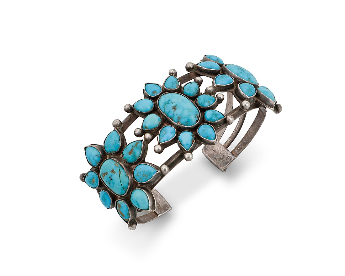 A Dine (Navajo) or Zuni sterling silver and turquoise cuff bracelet (1 of 2)