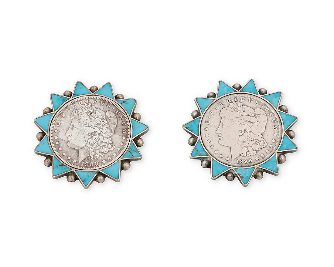 A pair of Zuni silver coin and turquoise pins: A pair of Zuni silver coin and turquoise pins Mid-20th century Each designed with a Morgan silver dollar framed within a turquoise-inlaid sunburst surround with silver drop accents. Unmarked Other Not