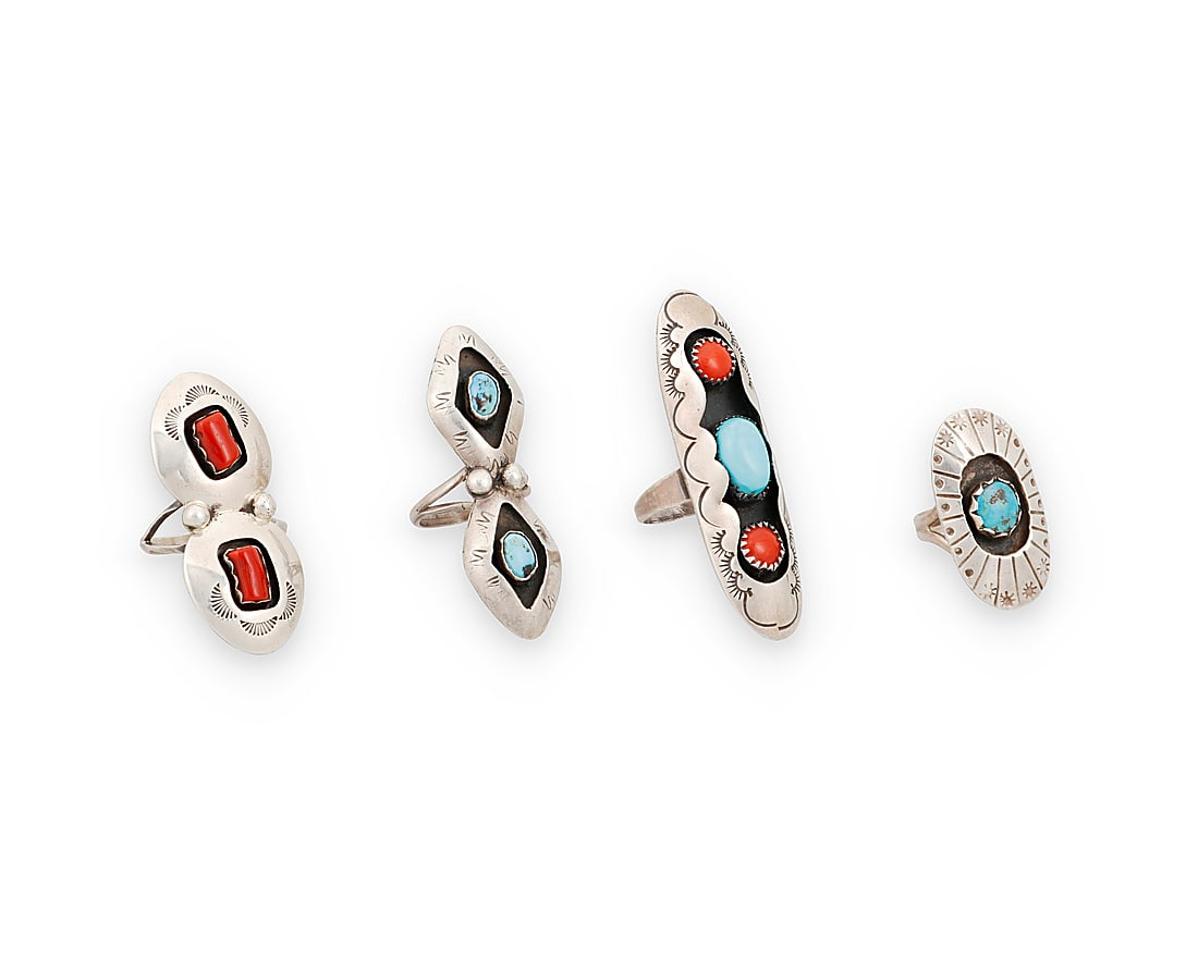 Four Southwest sterling silver and turquoise rings: Four Southwest sterling silver and turquoise rings Mid/late 20th century A group of shadow set sterling silver rings with set turquoise and set coral, including a double set coral ring by Valerie Good