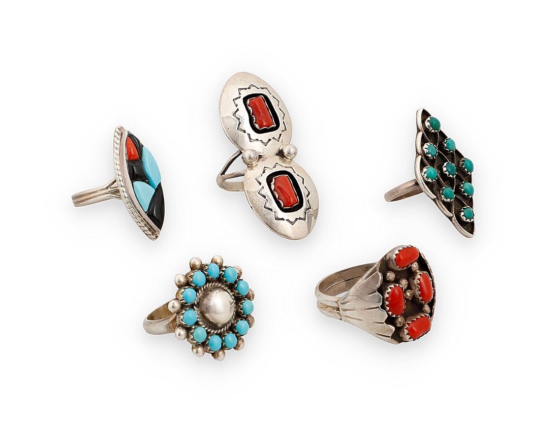 Five Southwest sterling silver and set stone rings: Five Southwest sterling silver and set stone rings Mid/late 20th century A group of sterling silver rings in various set stone styles including a shadow set coral ring by Valerie Goodluck (20th centur