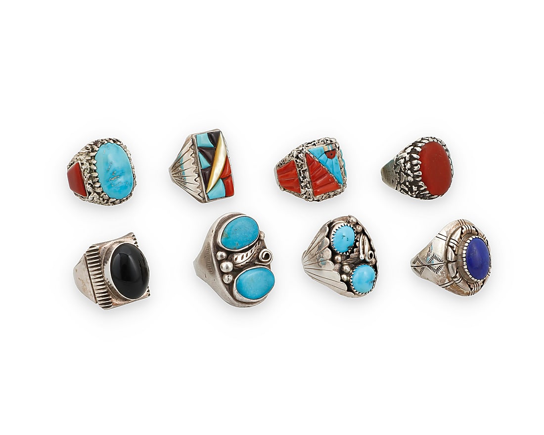Eight large Southwest silver and set stone rings: Eight large Southwest silver and set stone rings Mid/late 20th century A group of chunky sterling silver rings, including three by Lee & Mary Weebothee (Zuni), one with elaborate sculptural coral and 