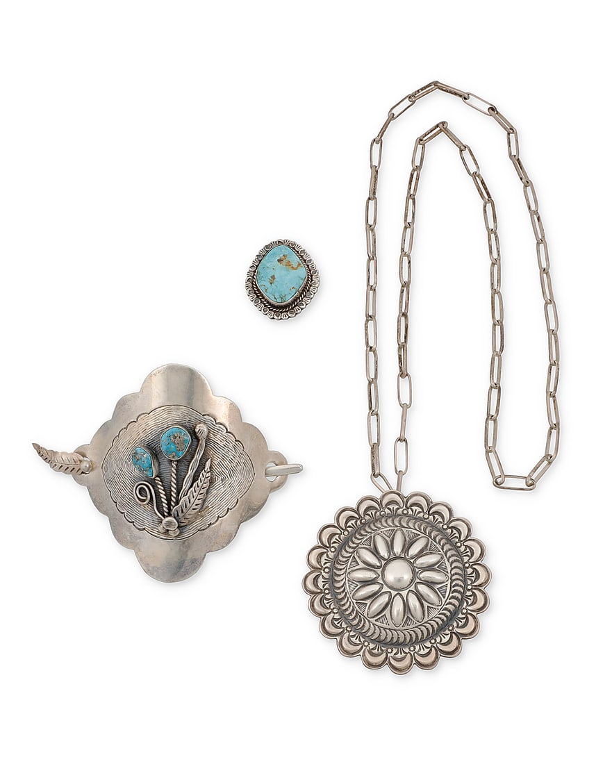 Four Southwest silver jewelry items: Four Southwest silver jewelry items Mid/late 20th century Comprising a large hammered silver hair slide with fine line incised texture to center and a stylized floral motif of set turquoise and applie