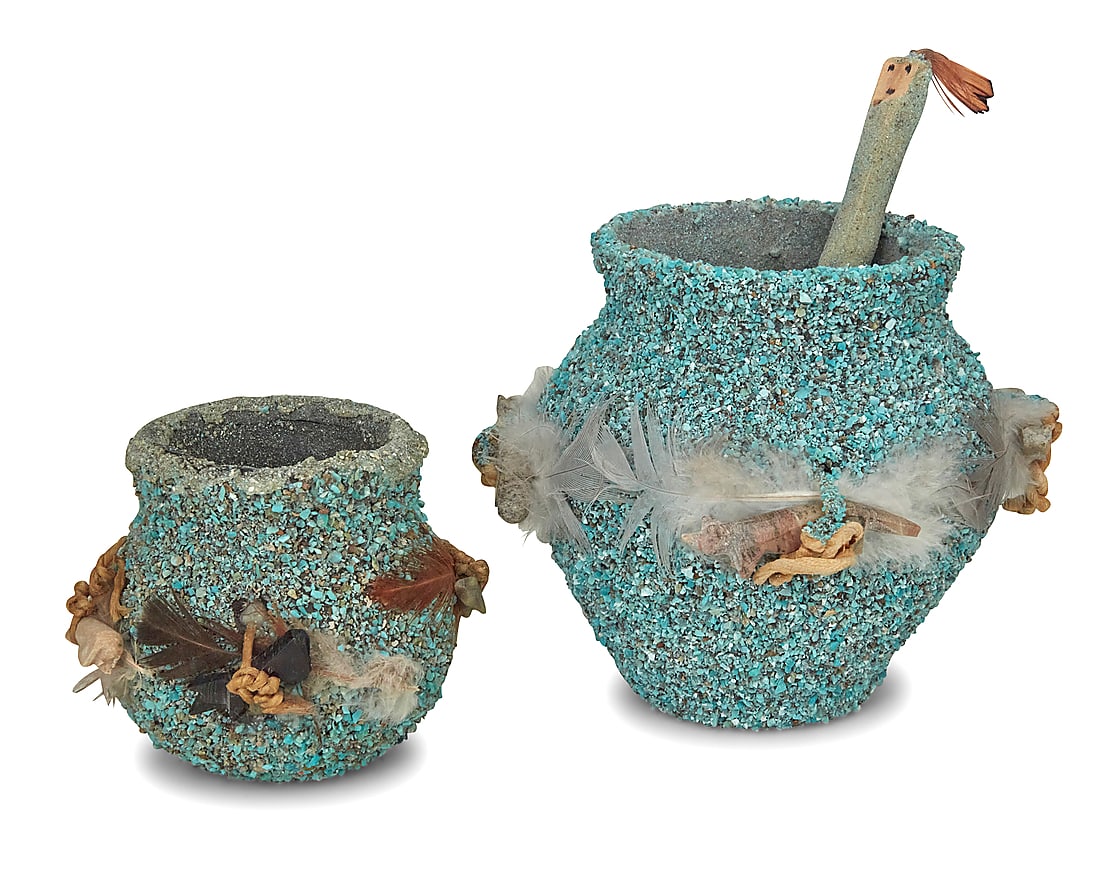 Two Zuni Pueblo turquoise encrusted pottery fetish jars: Two Zuni Pueblo turquoise encrusted pottery fetish jars Second half 20th century Each jar with applied ground turquoise chips and mounted with carved stone fetish animals and feathers, the larger jar