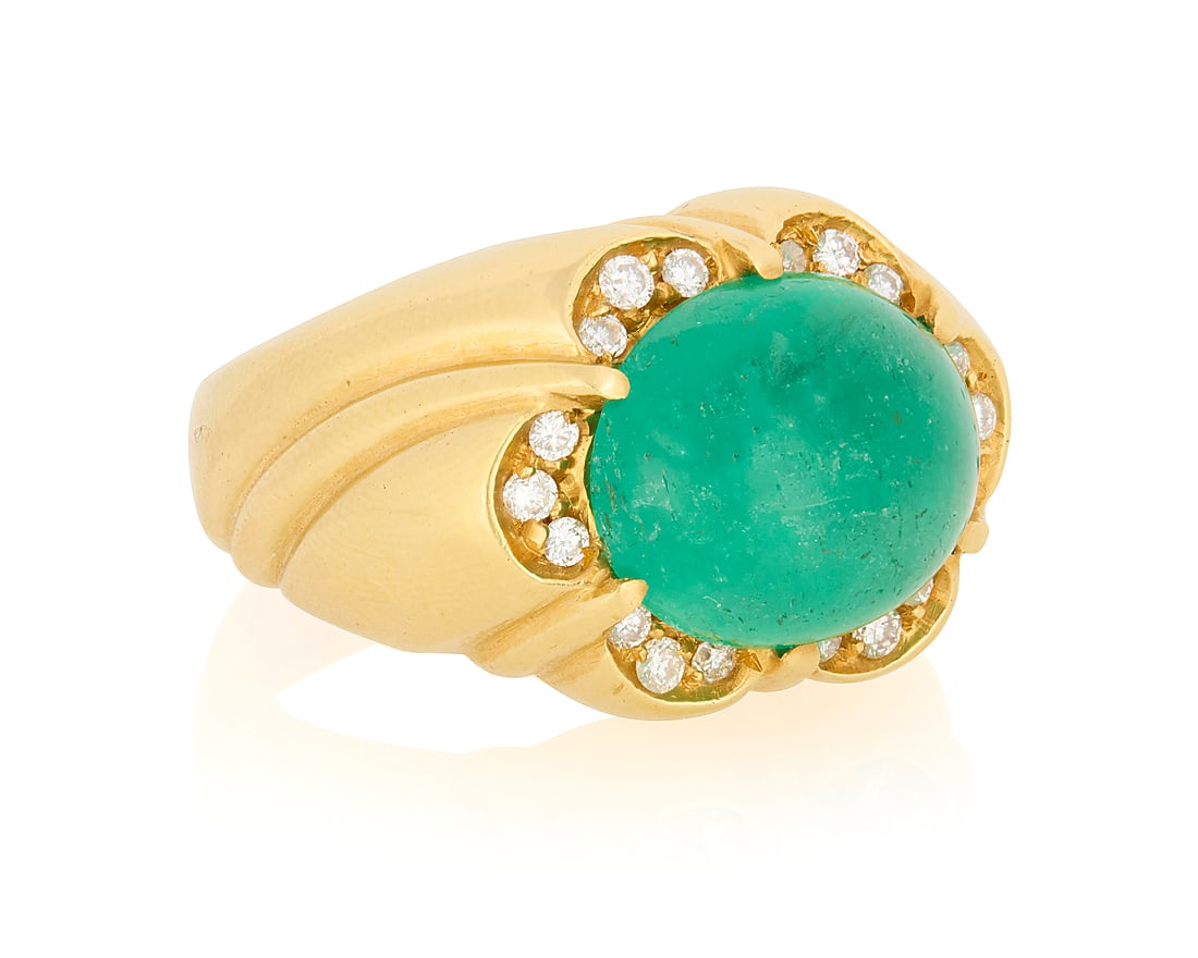 An 18K Gold, Emerald and Diamond Ring Centering an oval emerald cabochon weighing approximately (1 of 3)