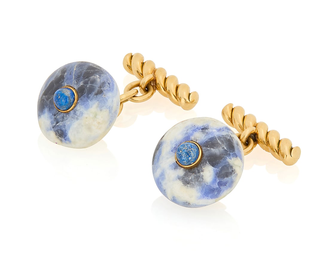 Gucci: A Pair of 18K Gold, Sodalite and Lapis Lazuli Cufflinks Each featuring polished sodalite: Gucci: A Pair of 18K Gold, Sodalite and Lapis Lazuli Cufflinks Each featuring polished sodalite centering a round lapis lazuli cabochon, finished with a twisted gold motif, signed Gucci, Italy 2 piece