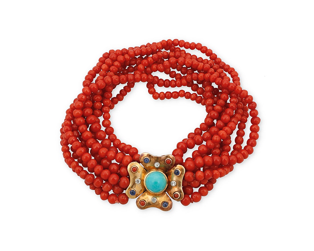 An 18K Gold, Coral and Gem-Set Bracelet Featuring eight strands of graduated coral beads measuring: An 18K Gold, Coral and Gem-Set Bracelet Featuring eight strands of graduated coral beads measuring approximately 3.25 - 5.40 mm, a gold floral clasp accented by turquoise, coral and sapphire cabochons