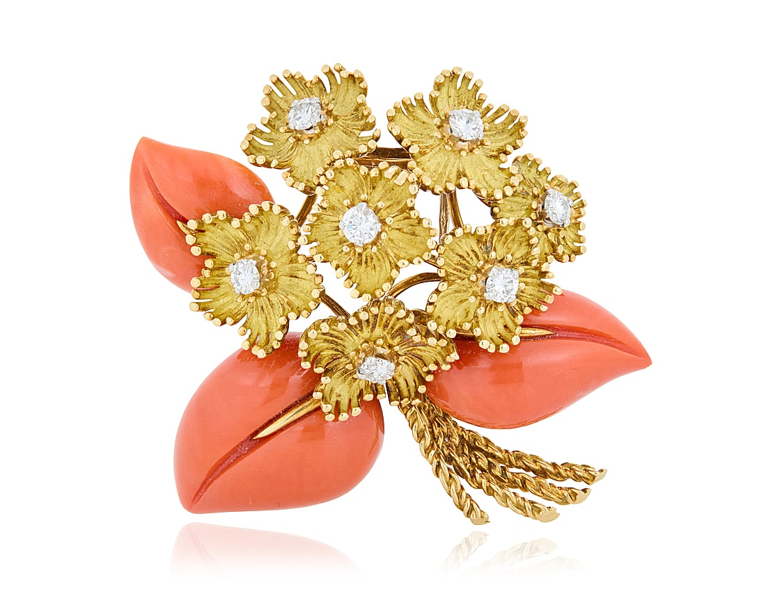 A French 18K Gold, Diamond and Coral Brooch Of flower motif design, set with round brilliant-cut: A French 18K Gold, Diamond and Coral Brooch Of flower motif design, set with round brilliant-cut diamonds weighing approximately 0.70 carat total Measures: 2 x 2 in. 25.9 grams gross