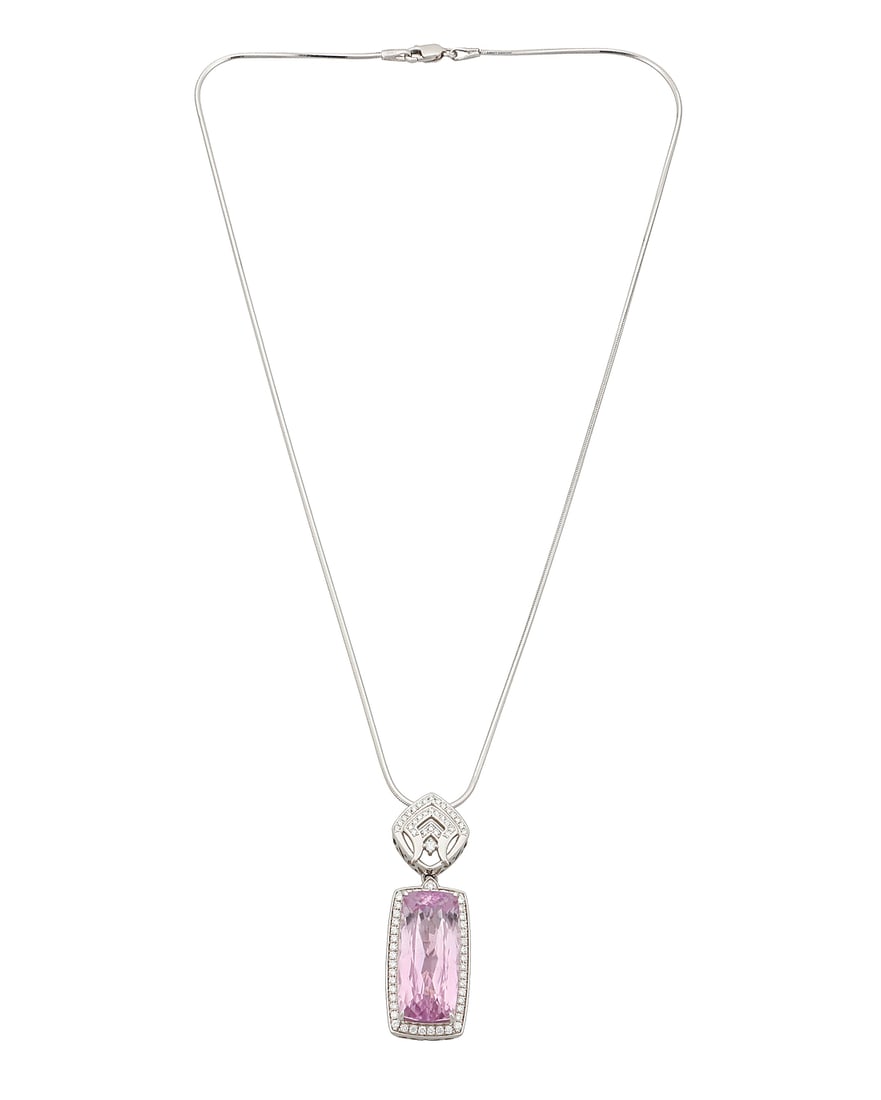 A 14K White Gold, Kunzite and Diamond Necklace Centering an elongated cushion mixed-cut kunzite: A 14K White Gold, Kunzite and Diamond Necklace Centering an elongated cushion mixed-cut kunzite weighing approximately 18.36 carats, set in an ornate frame accented by round diamonds weighing approxim