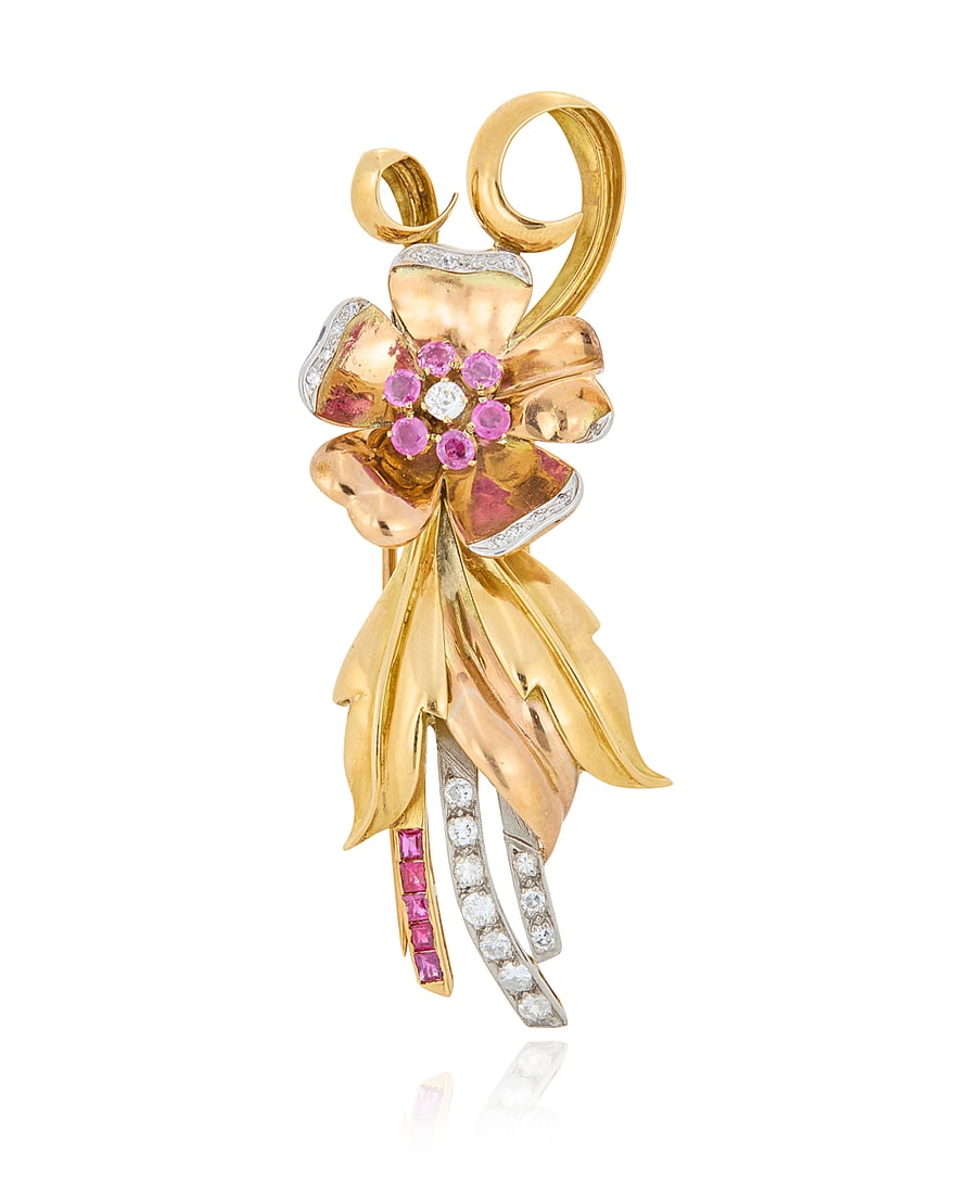 A Retro Tri-Color Gold, Diamond and Ruby Brooch Of a floral design featuring white, rose and: A Retro Tri-Color Gold, Diamond and Ruby Brooch Of a floral design featuring white, rose and yellow petals, accented by channel-set and round rubies, finished with transitional-cut and single-cut diam