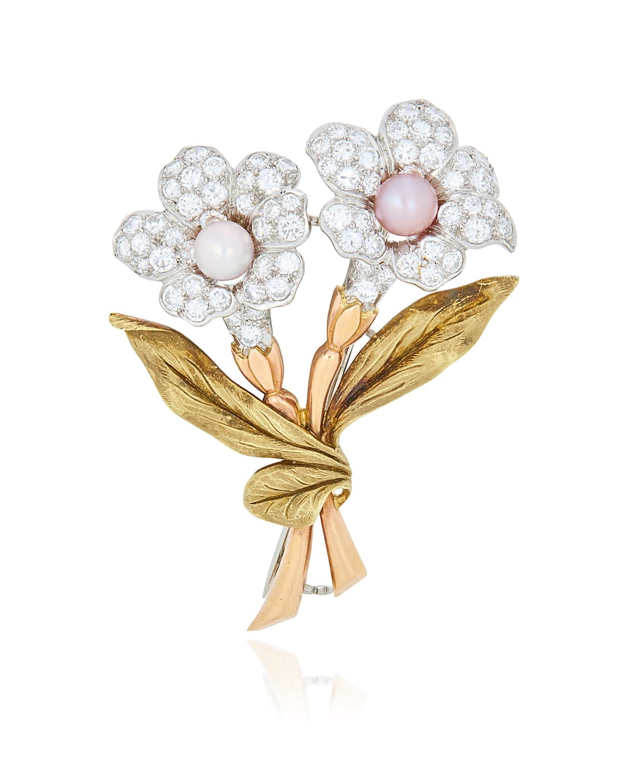 A Bi-Color Gold, Platinum, Pearl and Diamond Brooch Of a floral bouquet design, featuring leaves: A Bi-Color Gold, Platinum, Pearl and Diamond Brooch Of a floral bouquet design, featuring leaves and stems of rose and yellow gold, topped with flowers of platinum centering a white and pink pearl fin