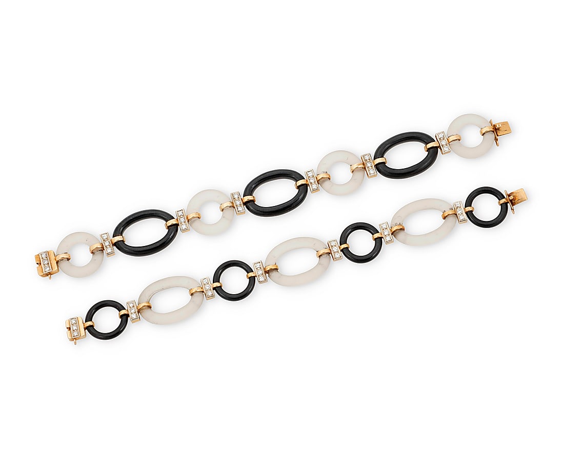 Pair of 14K Gold, Onyx and Rock Crystal Bracelets Featuring oval and round links of carved rock: Pair of 14K Gold, Onyx and Rock Crystal Bracelets Featuring oval and round links of carved rock crystal quartz and onyx, accented by round diamonds weighing approximately 1.58 carats total 2 pieces Le