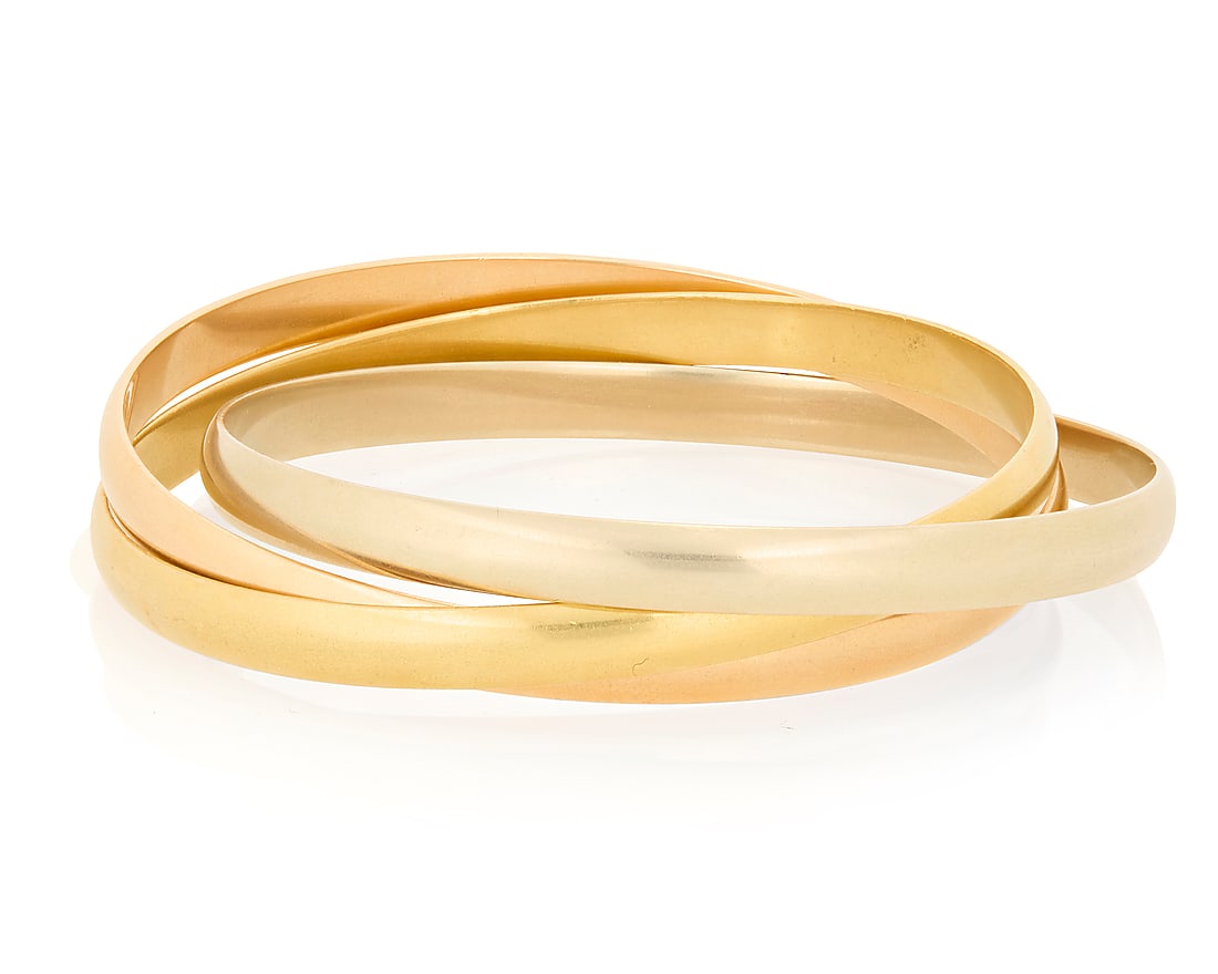 Cartier: An 18K Tri-Color Gold 'Trinity de Cartier' Bracelet Featuring three interlocking bangles: Cartier: An 18K Tri-Color Gold 'Trinity de Cartier' Bracelet Featuring three interlocking bangles of yellow, white and rose gold, signed Cartier, 738530, 64, with original box and papers Inner Circumf