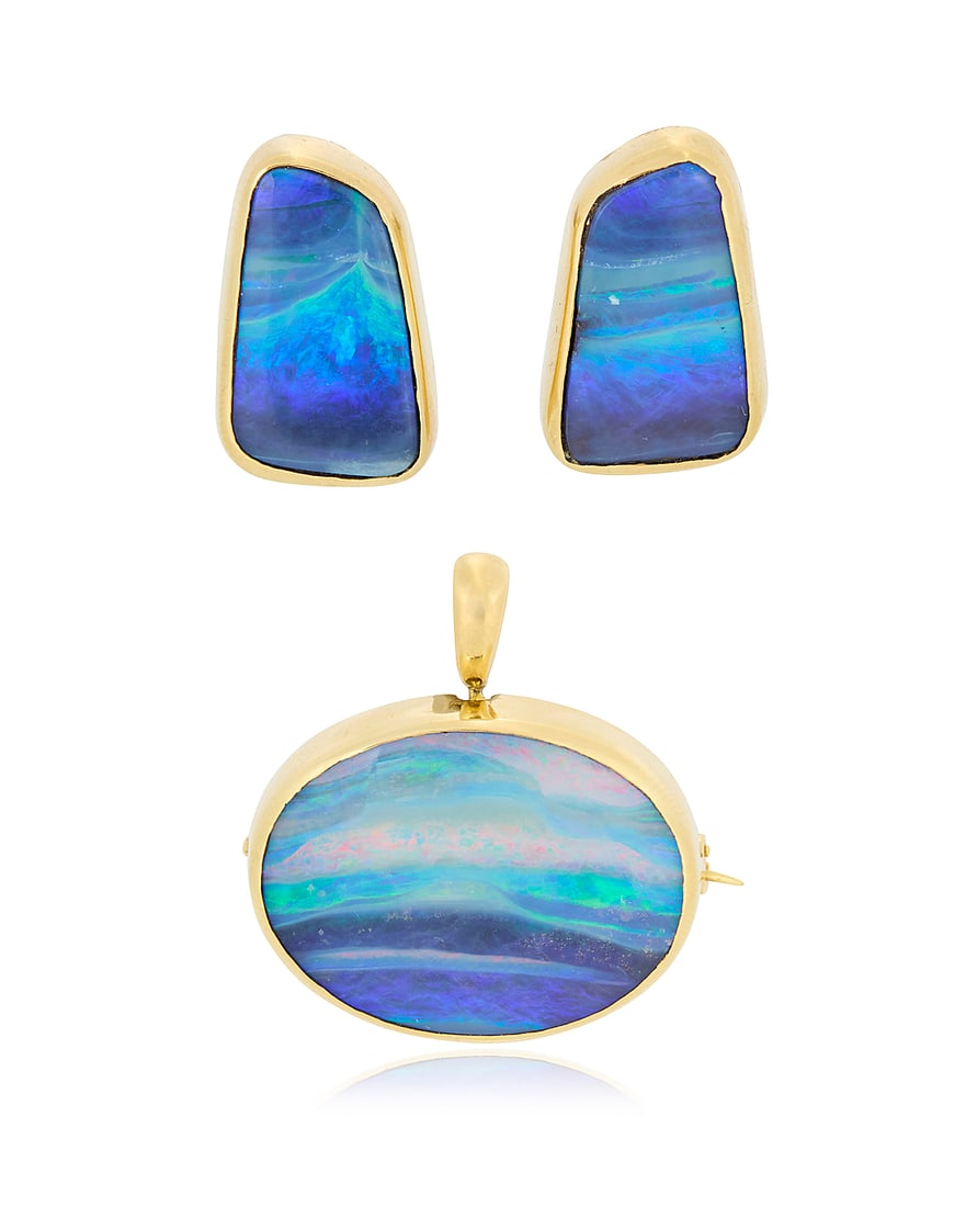 An 18K Gold and Boulder Opal Set Including a brooch/pendant and a pair of earrings of an organic (1 of 5)