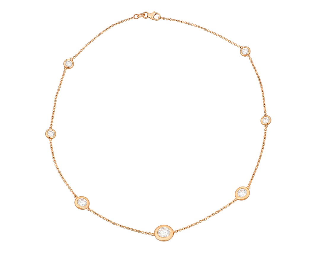 An 18K Rose Gold and Diamond Necklace Of a station design featuring seven graduated diamonds: An 18K Rose Gold and Diamond Necklace Of a station design featuring seven graduated diamonds weighing approximately 3.40 carats Length: 16 in. 7.1 grams gross