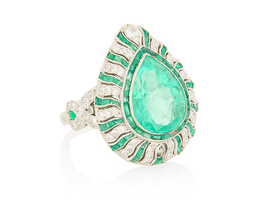 A Platinum, Emerald and Diamond Ring Featuring a pear-shaped emerald weighing approximately 4.15: A Platinum, Emerald and Diamond Ring Featuring a pear-shaped emerald weighing approximately 4.15 carats, accented by round diamonds weighing approximately 0.50 carat total Size: 6 1/2 10.9 grams gross