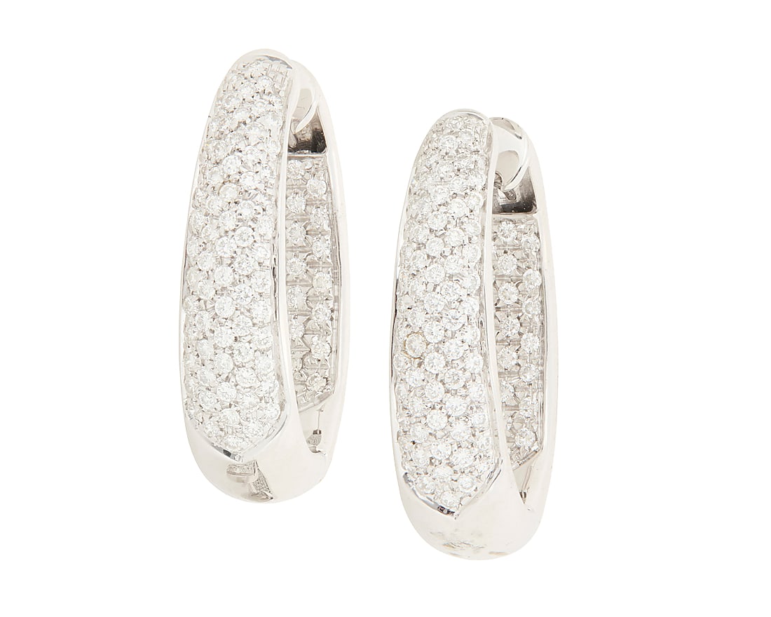 A Pair of 18K White Gold and Diamond Hoop Earrings Featuring round diamonds weighing approximately: A Pair of 18K White Gold and Diamond Hoop Earrings Featuring round diamonds weighing approximately 4.65 carats, set half on the inside and half of the front of a tapered design 2 pieces Measures: 1 1/