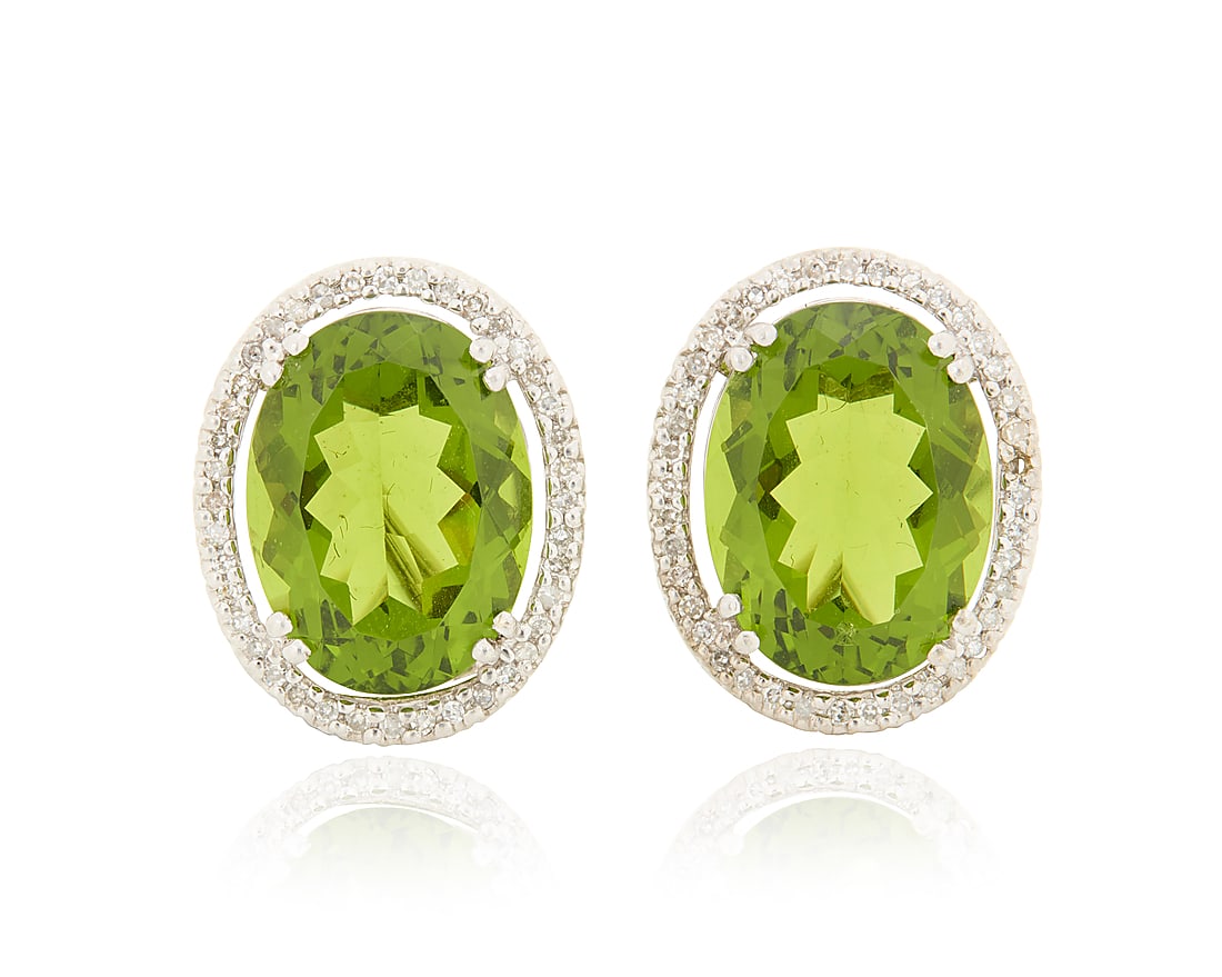 A Pair of 14K White Gold, Peridot and Diamond Earrings Centering two oval peridots weighing (1 of 3)