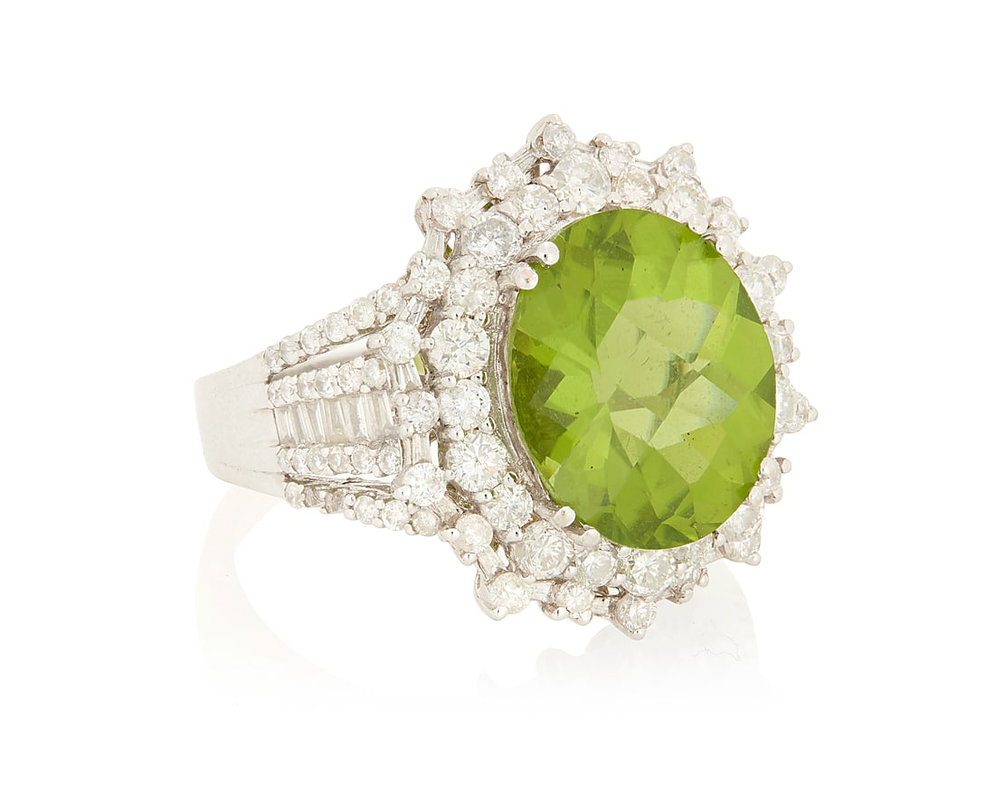 A 14K White Gold, Peridot and Diamond Ring Centering an oval mixed-cut peridot weighing (1 of 3)