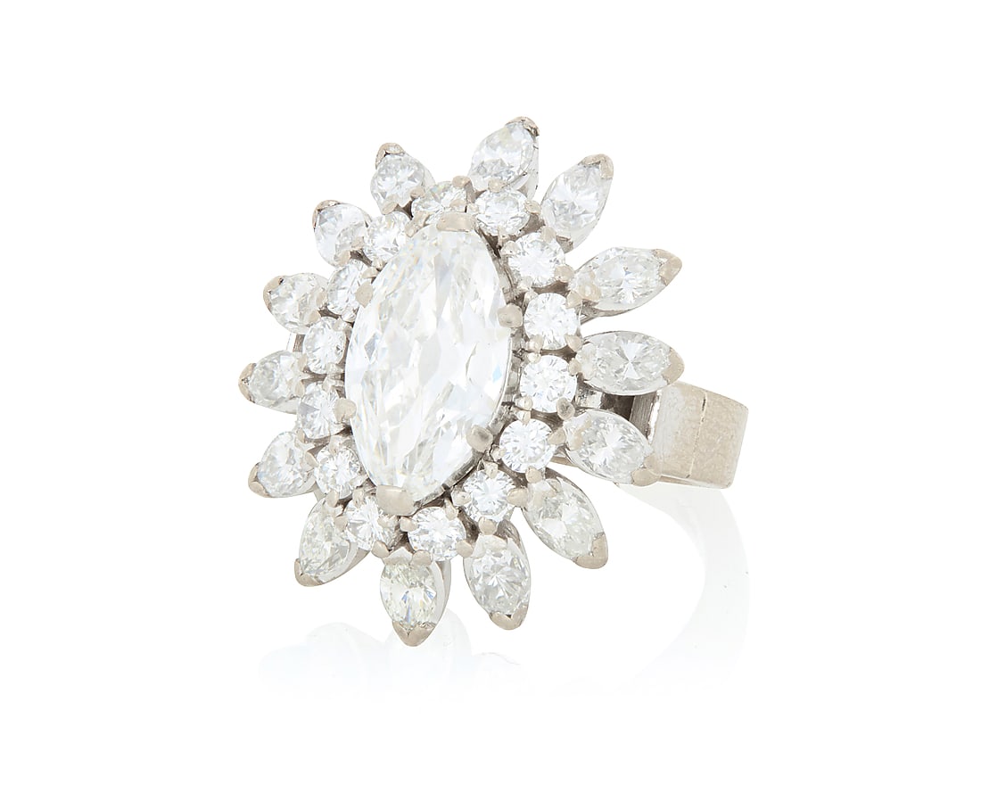 A 14K White Gold and Diamond Ring Centering a modified marquise-shaped diamond weighing 1.69: A 14K White Gold and Diamond Ring Centering a modified marquise-shaped diamond weighing 1.69 carats, accented by two rows of round and marquise-shaped diamonds weighing approximately 1.95 carats Size: