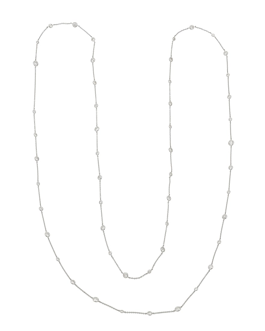 A 14K White Gold and Diamond Long Chain Featuring stations set with graduated round diamonds (1 of 3)