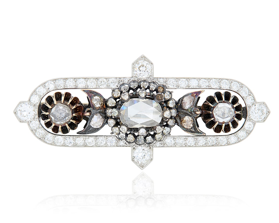 A Platinum, Gold and Diamond Brooch Featuring a platinum Cartier frame set with old European-cut (1 of 3)