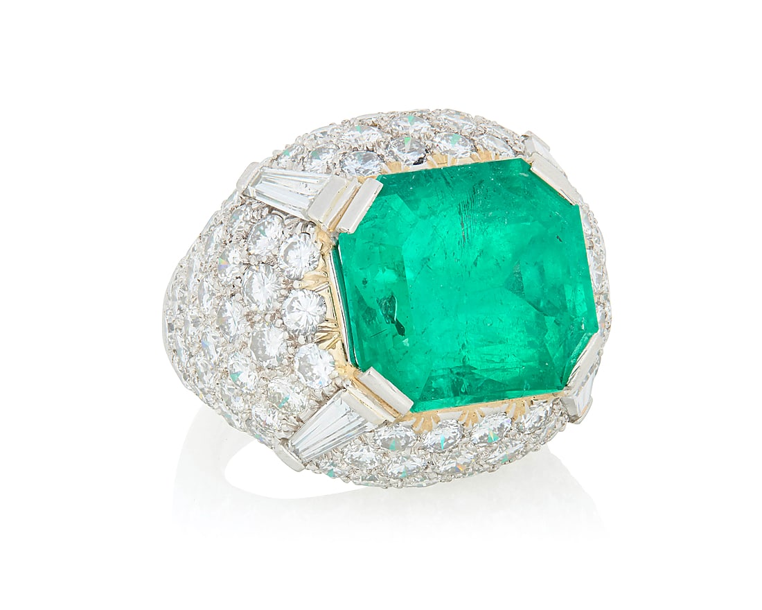 David Webb: A Platinum, Emerald and Diamond Ring Of a domed design centering a cut- cornered: David Webb: A Platinum, Emerald and Diamond Ring Of a domed design centering a cut- cornered rectangular step-cut emerald weighing approximately 11.88 carats accented by tapered baguette and round dia