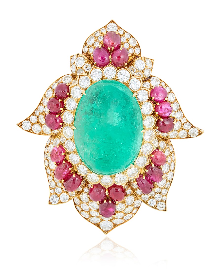 Harry Winston: An 18K Gold, Emerald, Ruby and Diamond Brooch Of a Mughal style design centering an: Harry Winston: An 18K Gold, Emerald, Ruby and Diamond Brooch Of a Mughal style design centering an oval emerald cabochon weighing approximately 66.77 carats, accented by oval ruby cabochons weighing a